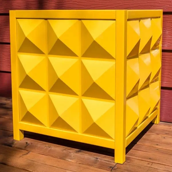 yellow modern outdoor planter box made of diamond shaped PVC panels