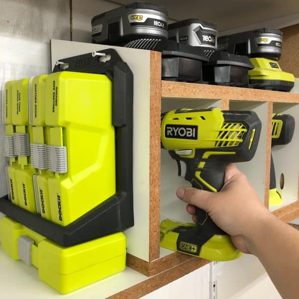 taking drill out of cordless drill storage rack