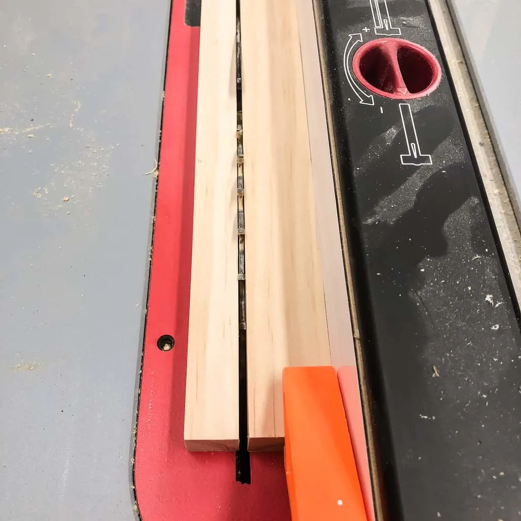 cutting ¾" wide strips from a 1x4 board on a table saw