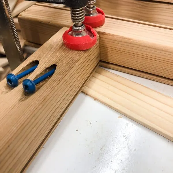 two grooved boards connected at a 90 degree angle with pocket hole screws