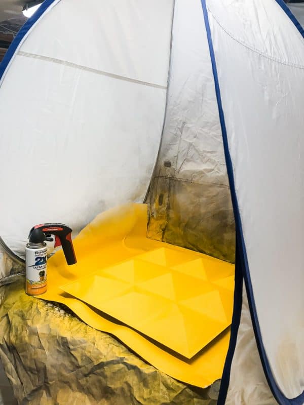 spray shelter with yellow painted PVC panel