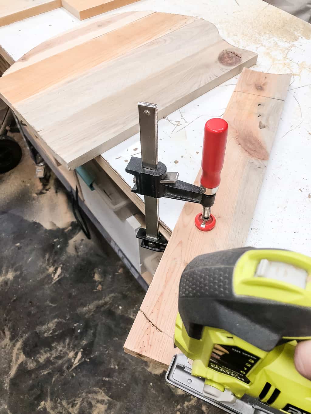 cutting out pumpkin shapes out of pallet wood with a jigsaw