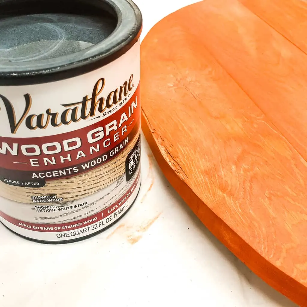 Varathane wood grain enhancer can next to pallet pumpkin