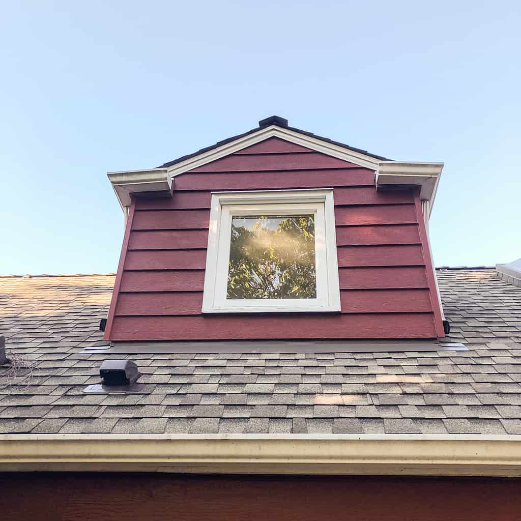 small dormer on the back of a Cape Cod style home