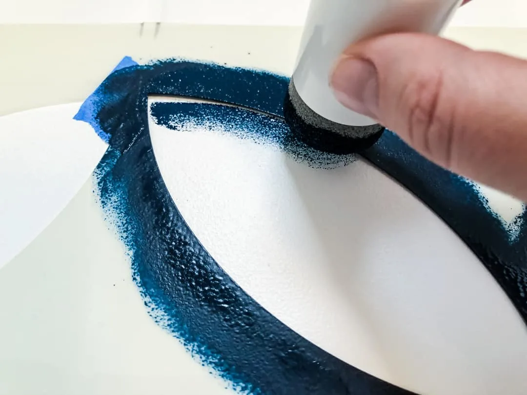 applying paint to tile stencil with foam pouncer