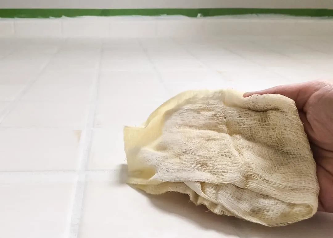 tack cloth removing sanding dust from tile floor before painting