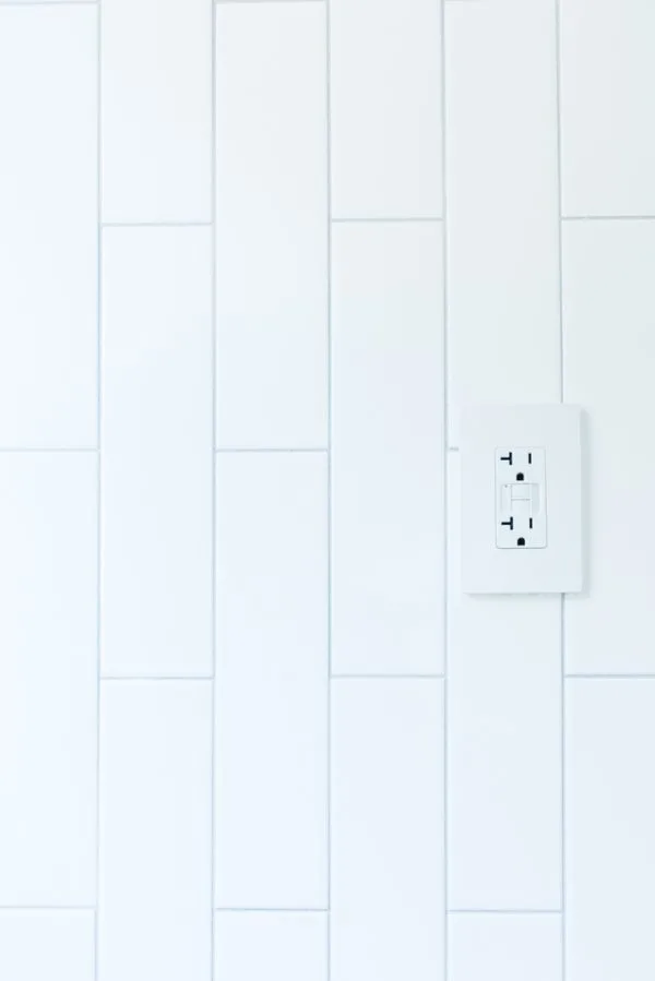 vertical subway tile with outlet