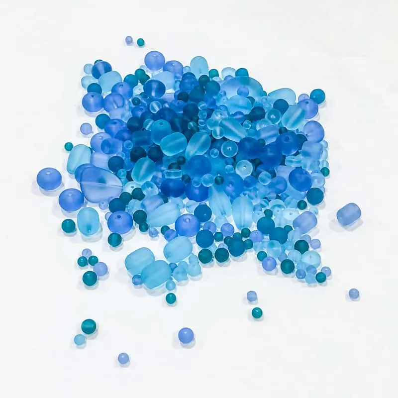 pile of beach glass beads in various shades of blue
