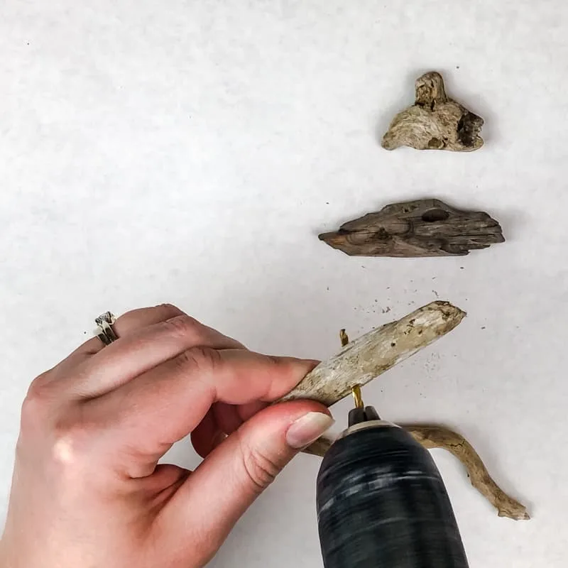 drilling hole in driftwood for Christmas tree ornament