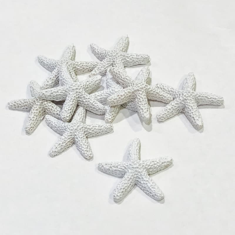 pile of white resin starfish