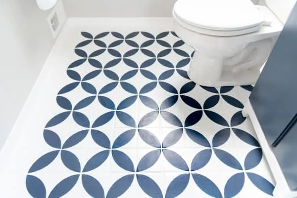 half bath remodel with painted and stenciled tile floor
