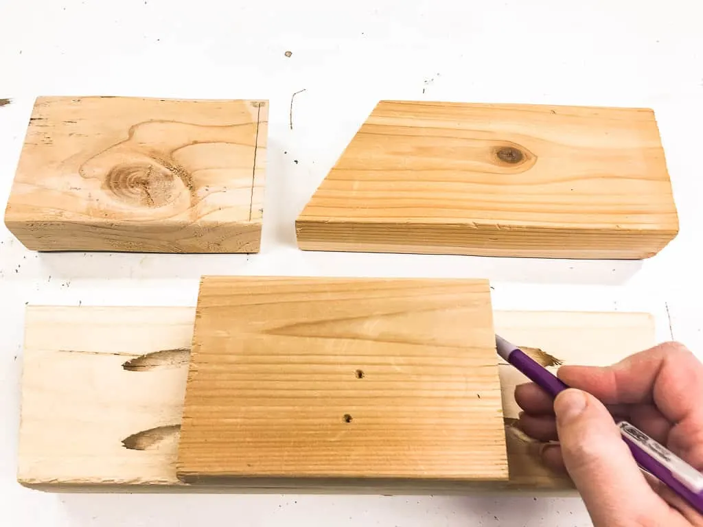 measuring scrap wood pieces for stocking hooks