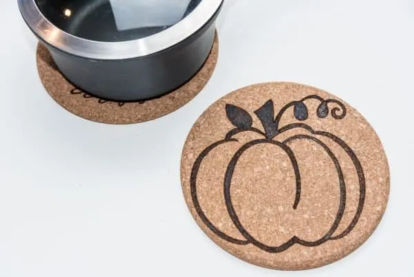 cork trivets with wood burning designs
