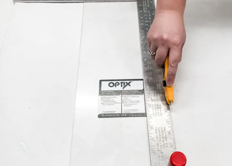 cutting plexiglass with plexiglass knife and straight edge