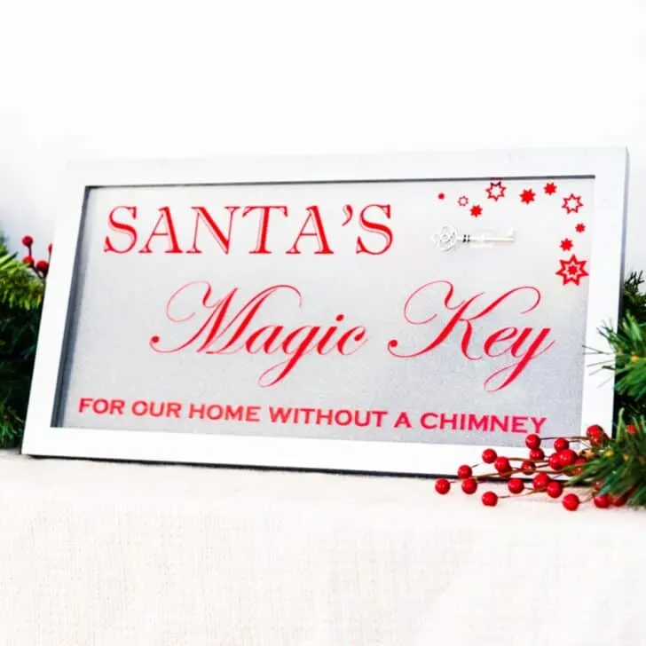 Santa's Magic Key sign surrounded by holiday garland
