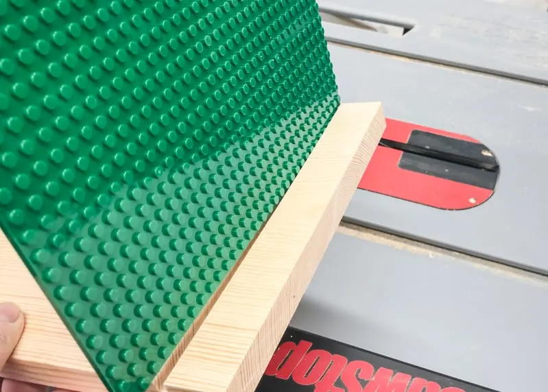 testing fit of lego baseplate slots in sides of lego bin