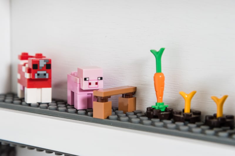 Lego minifigure display case shelf with Minecraft farm minifigures