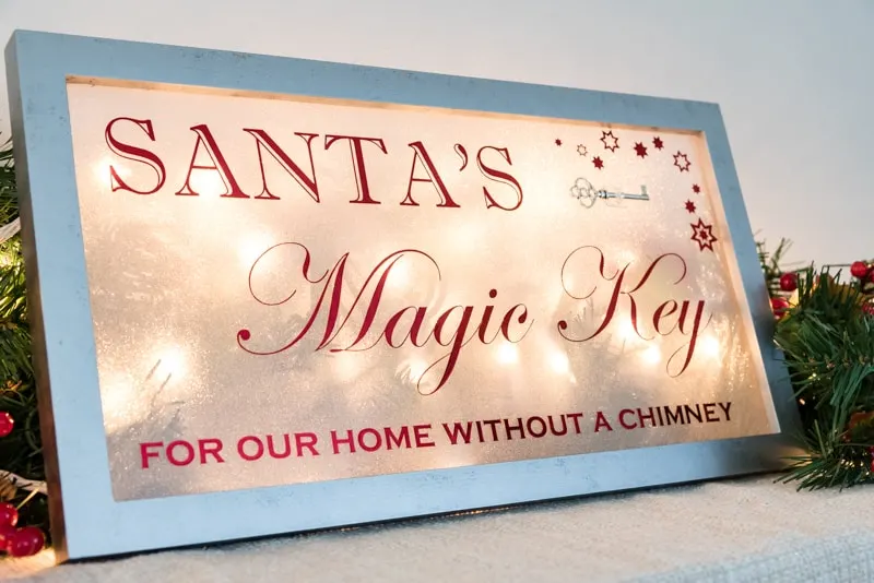 Santa's Magic Key sign lit up from behind