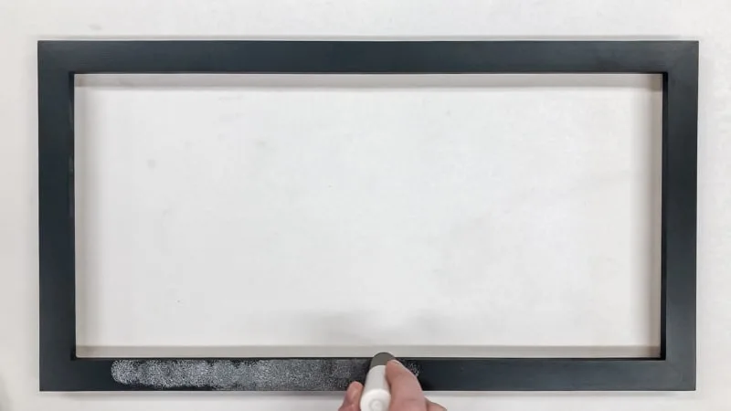 painting black frame with silver paint and foam pouncer
