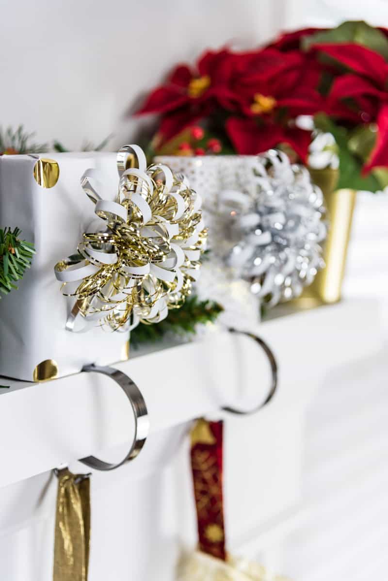 gift wrapped wooden blocks on stocking hooks