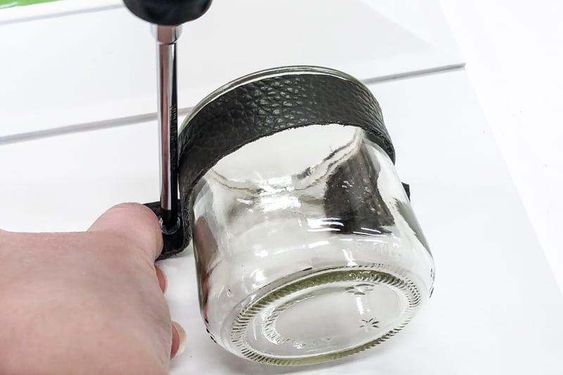 attaching a change jar to the bottom of an entryway mirror with a leather strap