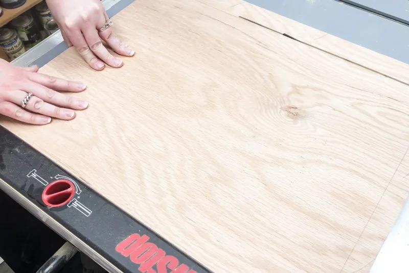 cutting plywood on a table saw for an entryway mirror