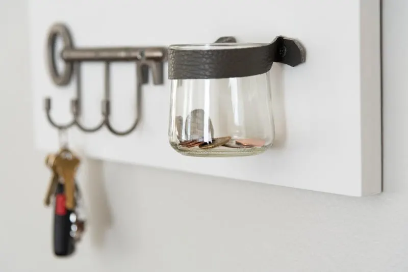 key shaped key hooks and change jar held to entryway mirror with leather strap