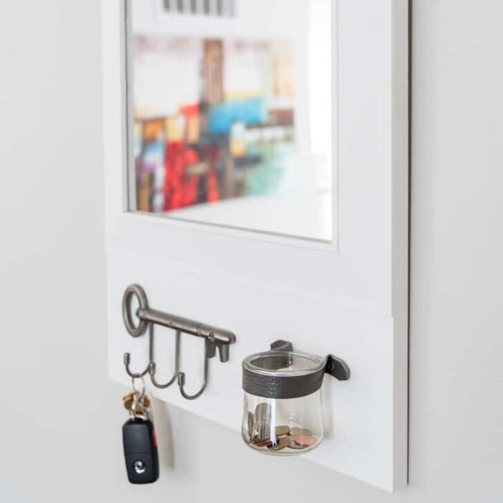 DIY entryway mirror with change jar and key hooks