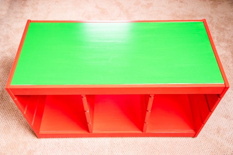 completed IKEA Trofast frame painted red with green top