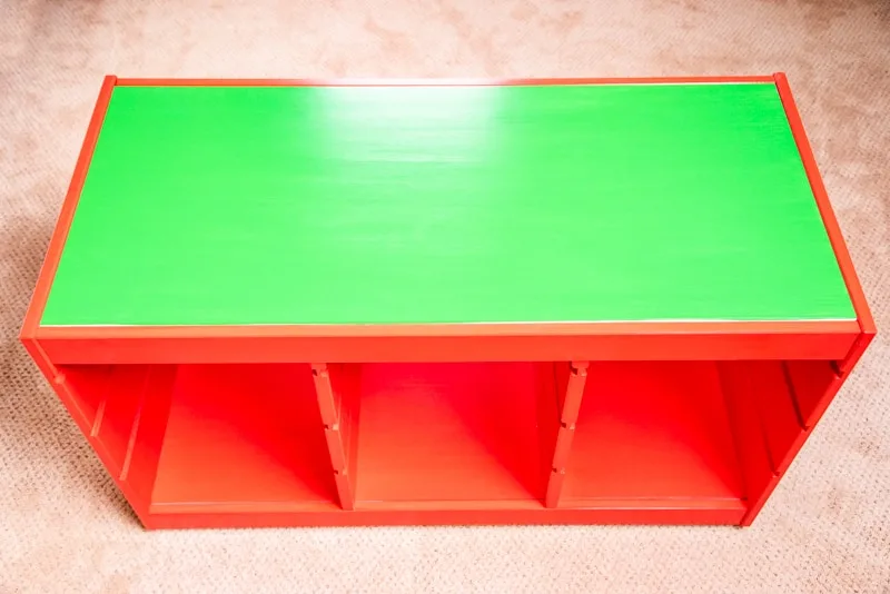 completed IKEA Trofast frame painted red with green top