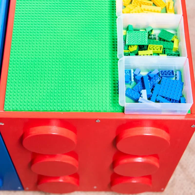 IKEA Trofast Lego table with Lego dots on side and bins on top