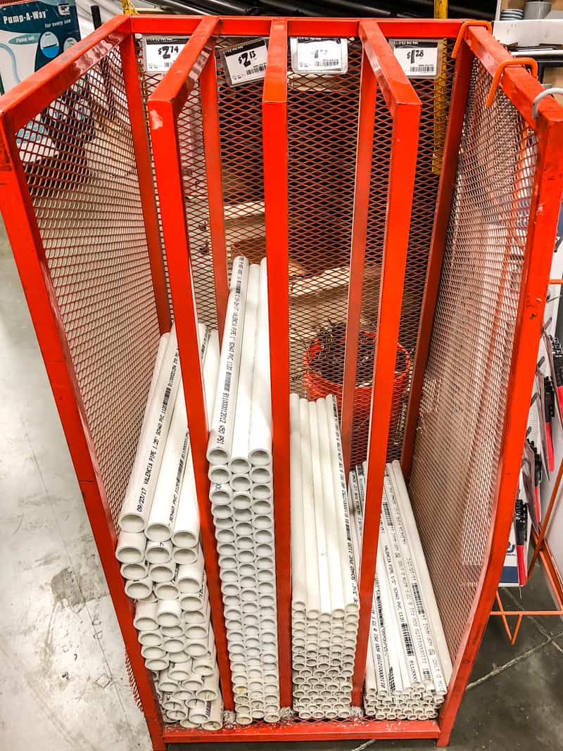 rack of precut PVC pipe at Home Depot