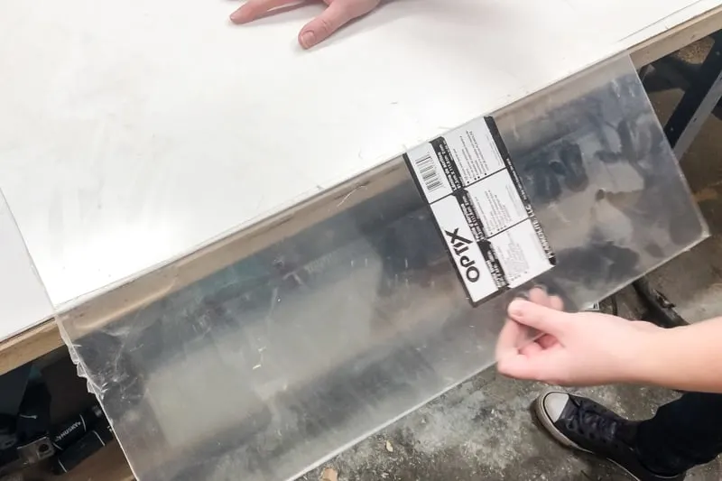 snapping an acrylic sheet that has been scored