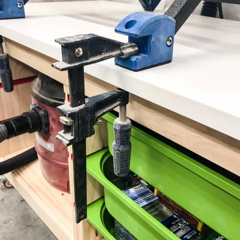 benchtop router table clamped to rolling tool stand top