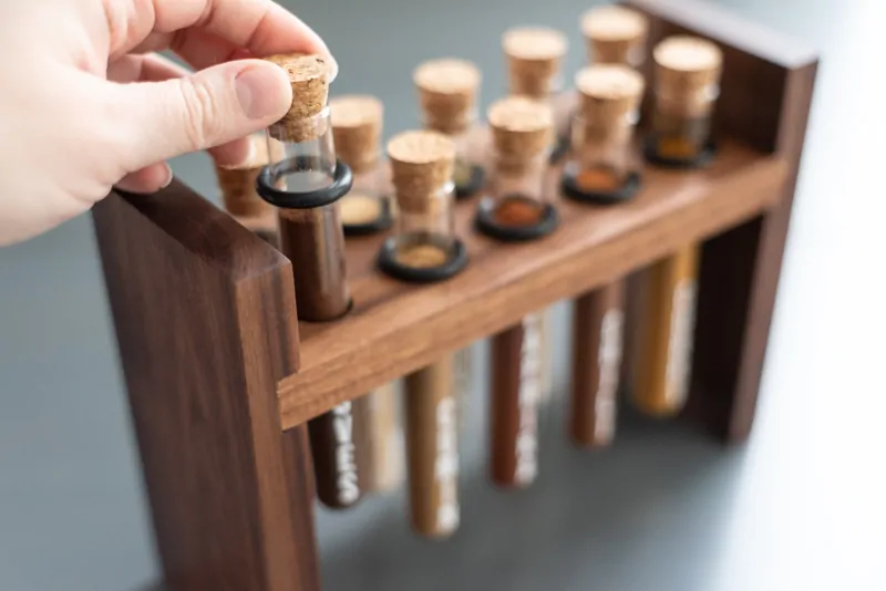 pulling one test tube out of DIY spice rack