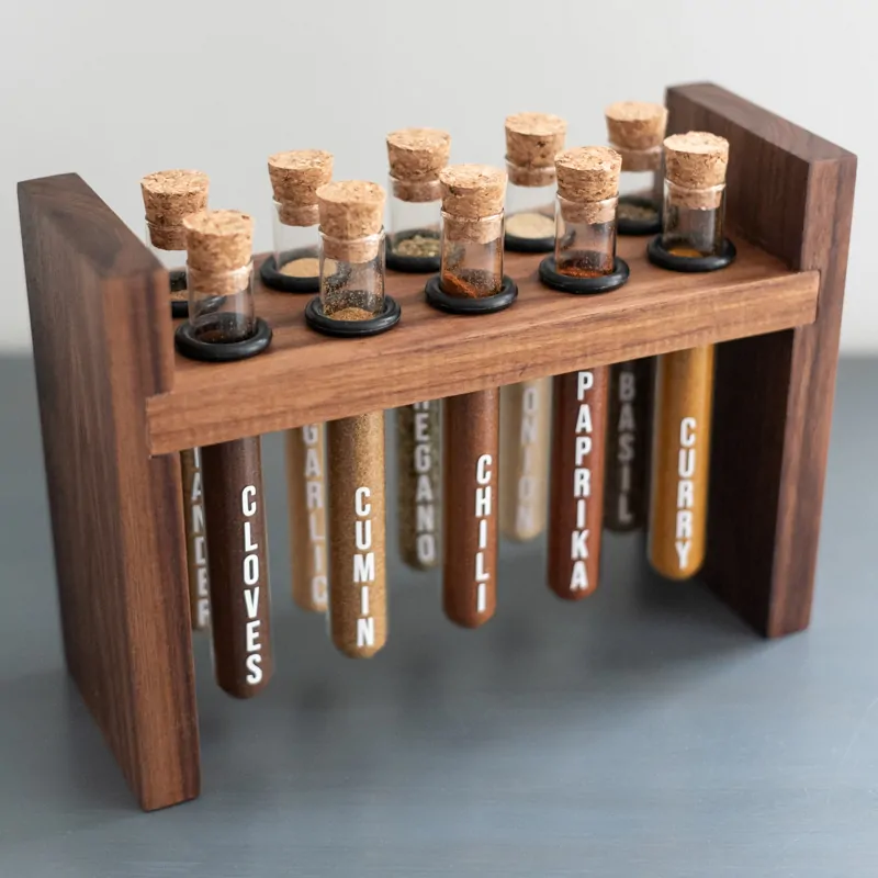 DIY spice rack with test tubes suspended from walnut frame