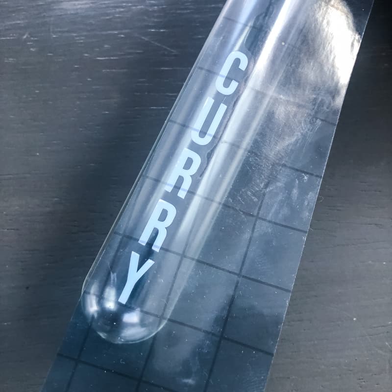 applying vinyl letters to glass test tube