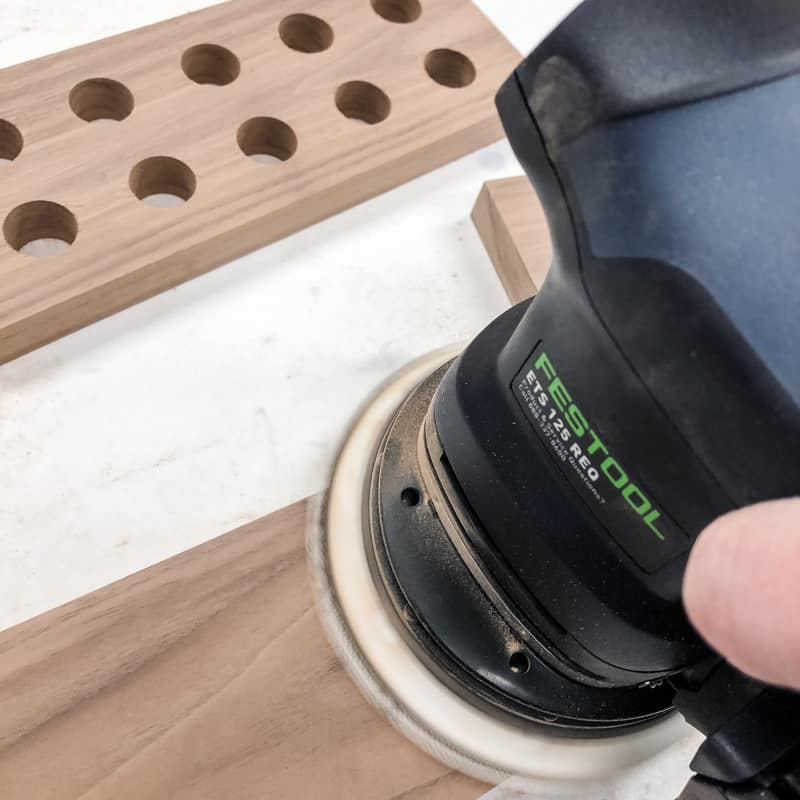 sanding walnut board with a Festool sander