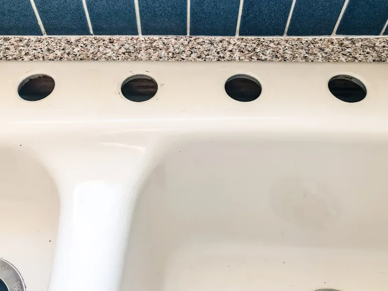 four hole kitchen sink cleaned for new faucet