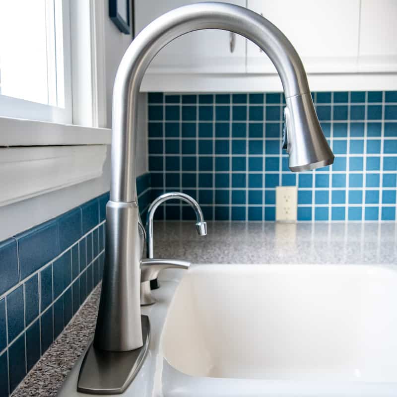 side view of new kitchen faucet, soap dispenser and instant hot water tap