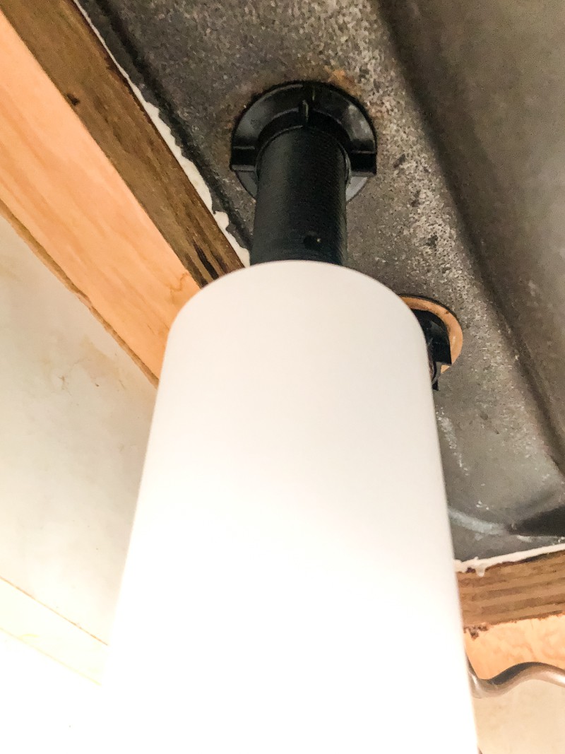 sink mounted soap dispenser view from underneath