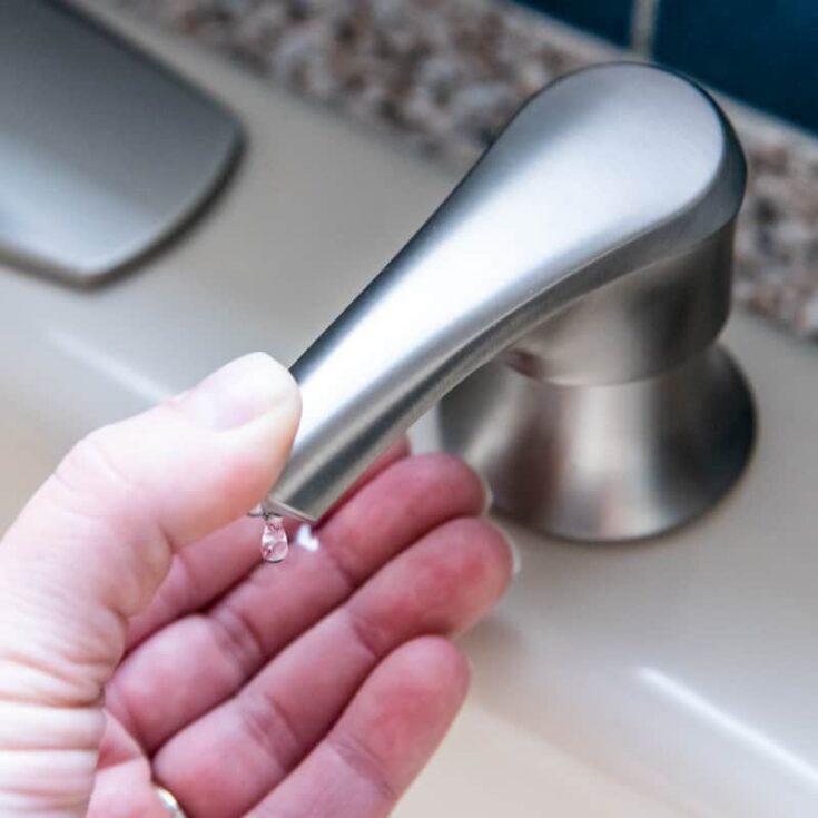 kitchen sink soap dispenser with one drop coming out