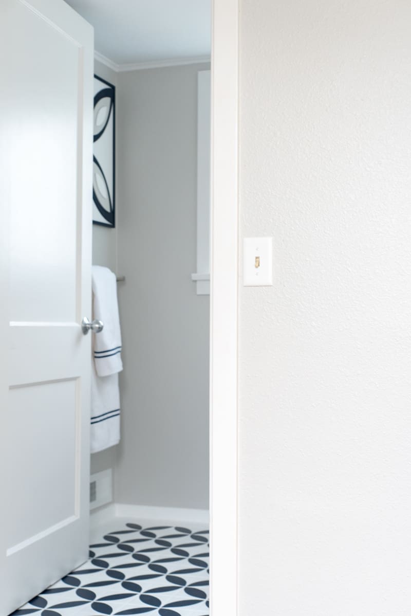 hallway looking into half bath