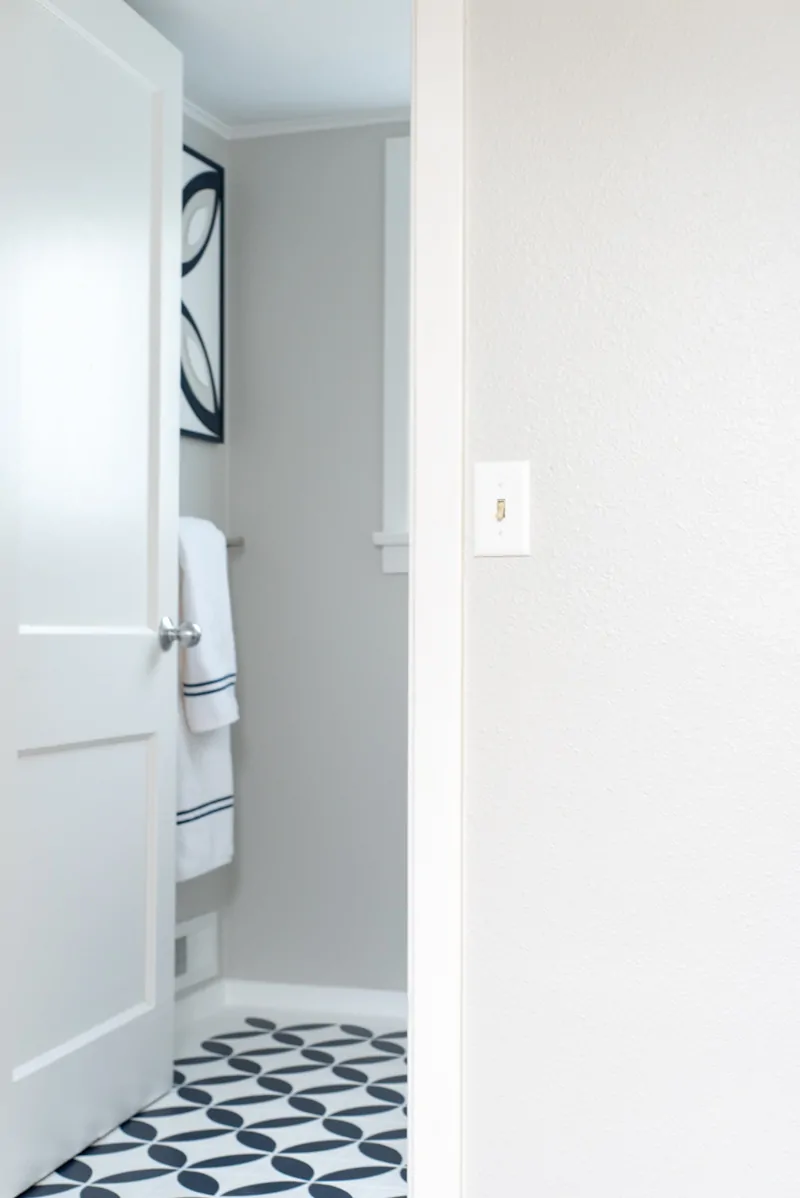 hallway looking into half bath