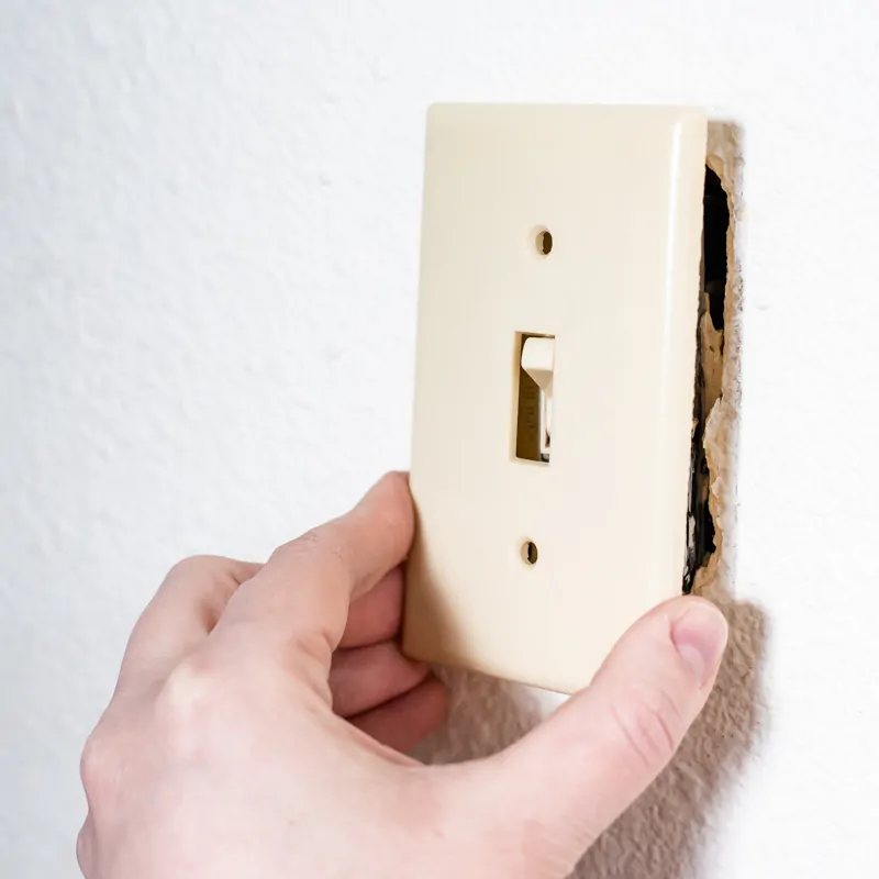 removing almond colored switch plate before painting textured walls