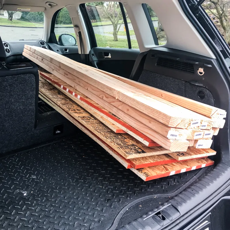Volkswagen Tiguan with fold flat front seat transporting lumber