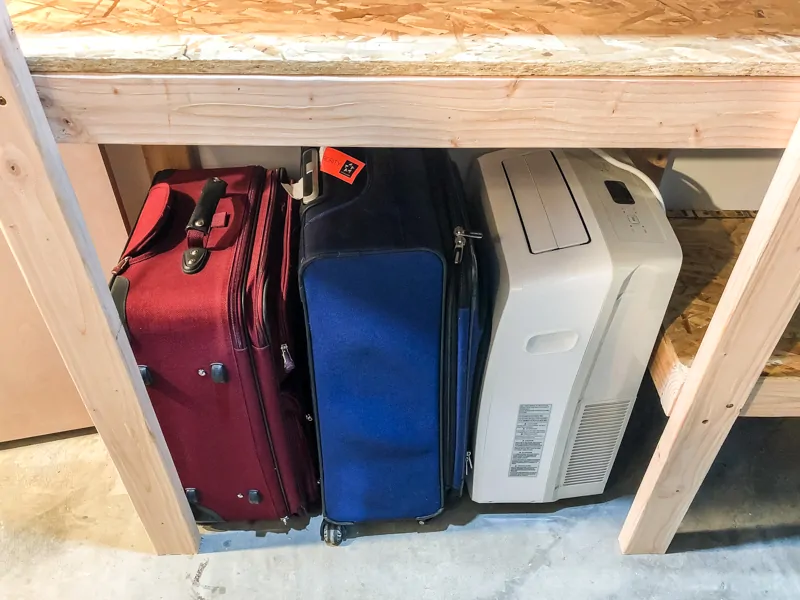 suitcases in custom sized space in garage shelves
