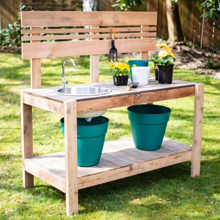 DIY potting bench with sink in grass