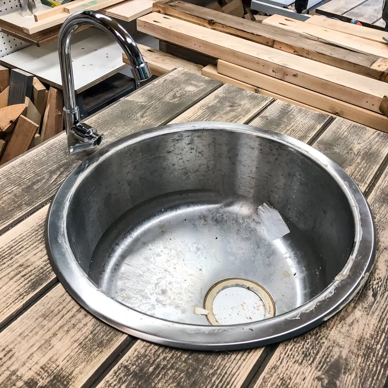 testing fit of sink and faucet in DIY potting bench countertop