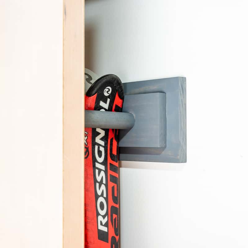 DIY ski rack mounted behind garage door